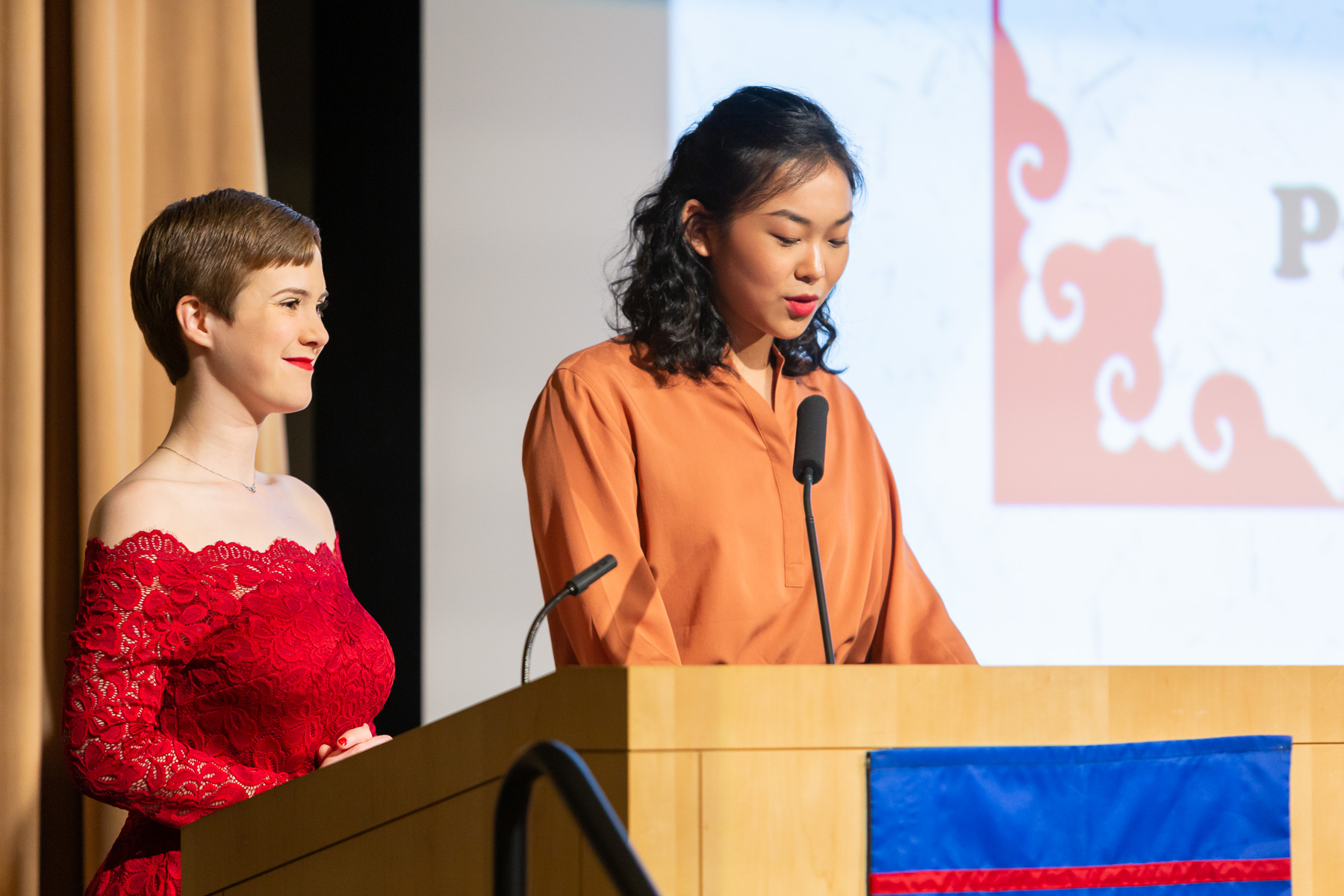 Amanda Stocchetti, president of the DePaul Chinese Studies Association, left, and Yi (Joy) Fang, president of the DePaul Chinese Students and Scholars Association, welcome guests to the event. (DePaul University/Randall Spriggs)